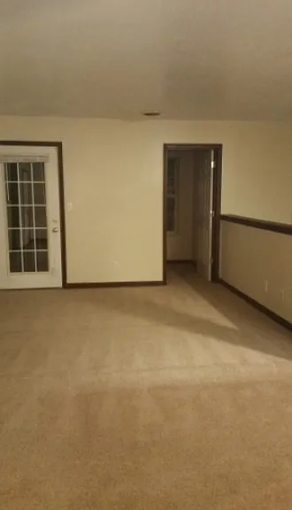 livingroom facing deck and bonus room