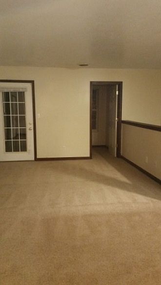 livingroom facing deck and bonus room