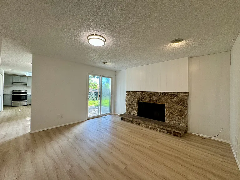 Spacious family room with wood fireplace