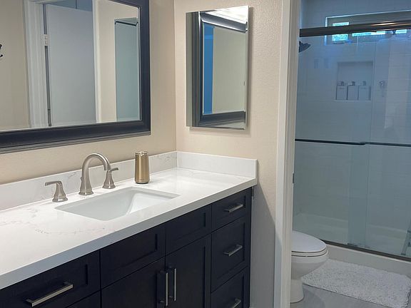 Primary bathroom with walk-in shower.