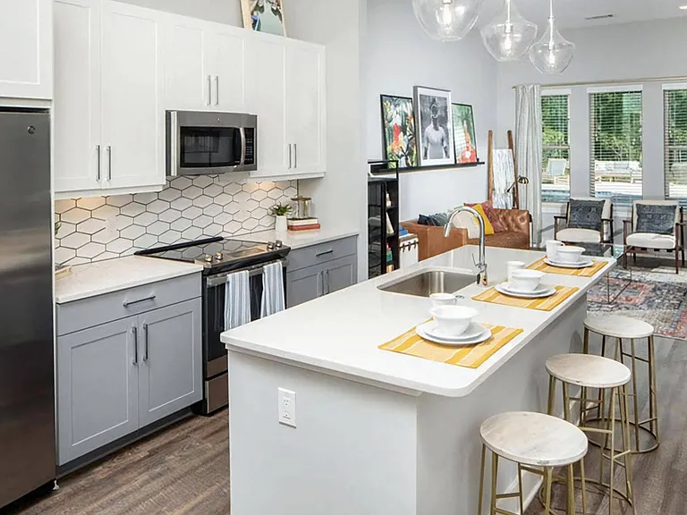 Stylish Open-Concept Kitchen with Quartz Counters and Two-Tone Cabinetry