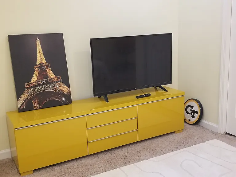 LCD TV set with remote control in the second bedroom