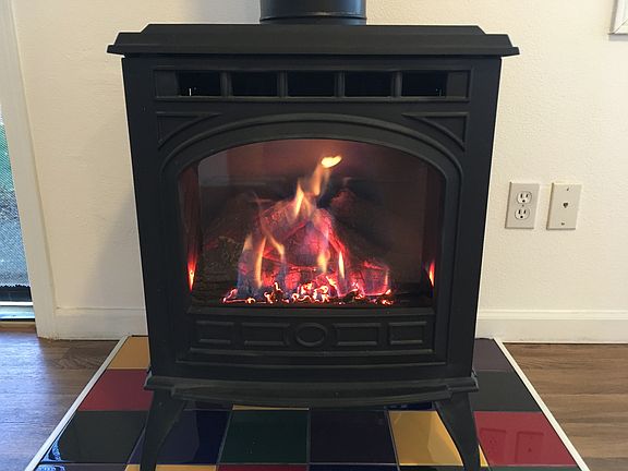Gas fireplace heats the whole house with a remote control thermostat, cozy, clean, quiet