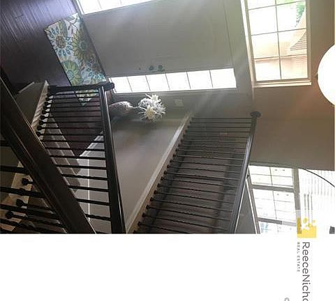 Hardwoods, designer carpet, and wrought iron.  What could be better?