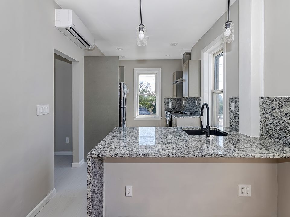 Kitchen with waterfall countertop.