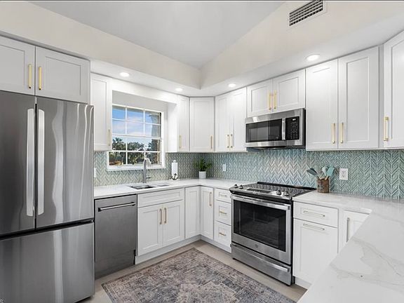 Kitchen with lake and golf course view from the window