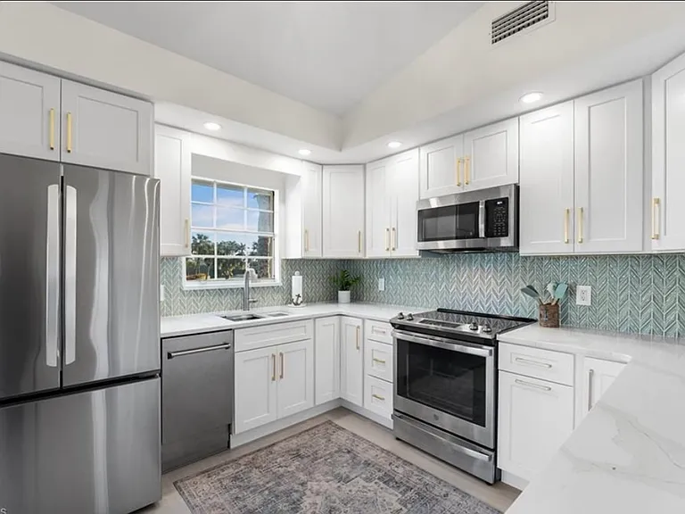 Kitchen with lake and golf course view from the window