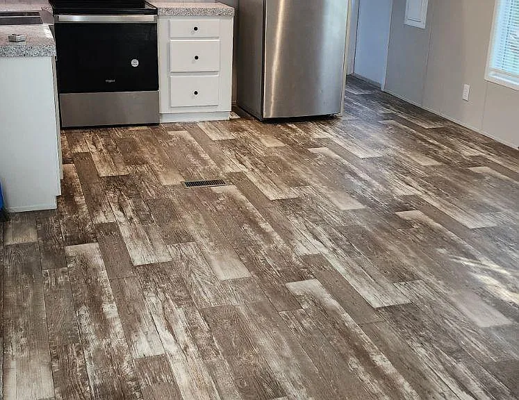 Kitchen, dinning, and partial living room view.