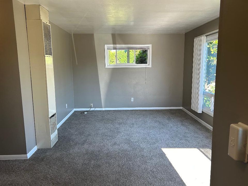 living room with large window and lots of natural light