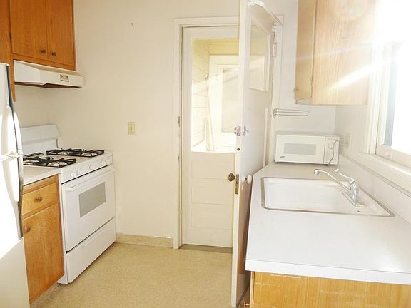 Kitchen has back entrance