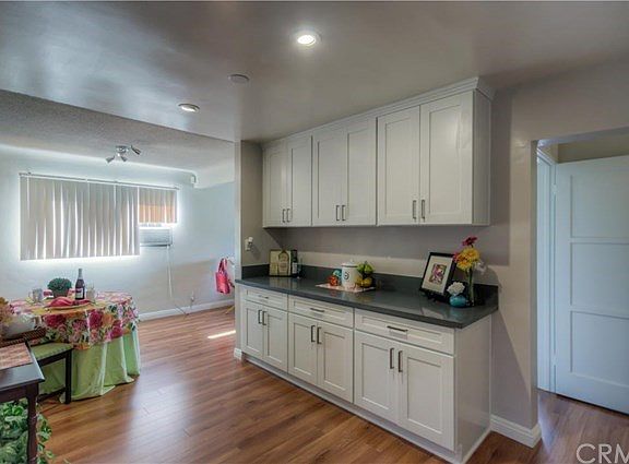 Walk through the dining room into the newly remodeled kitchen with new cabinets, quartz counters...