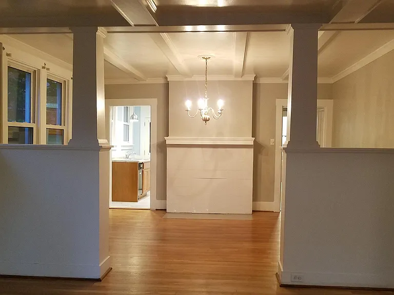 Large dining room with decorative fireplace.