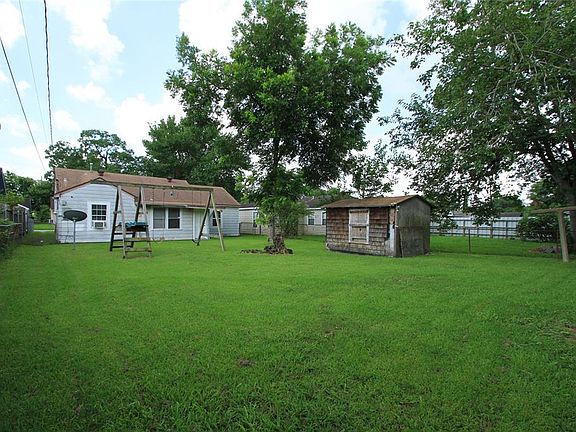 Look at this great Back Yard! It offers lots of room with a playset and storage shed with room leftover.