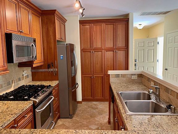 S/S, granite counter tops, custom cabinets, ample pantry space