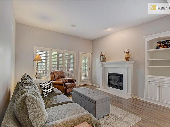 Light and bright fireplace for those cozy nights, built-in storage, plantation shutters, easy access to the screen porch.