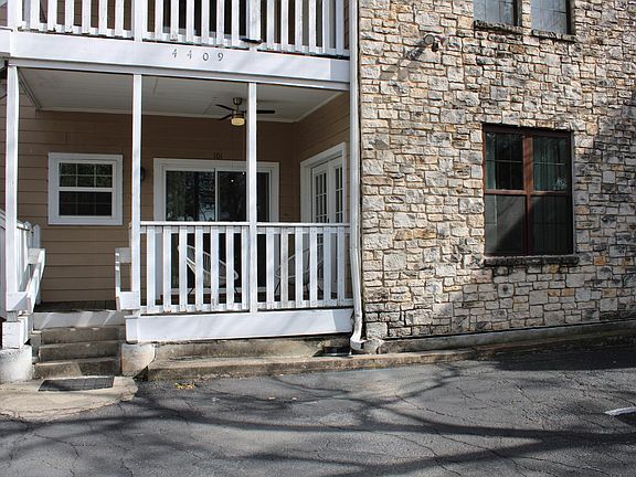 Just a few steps up to the front porch on this cute condo