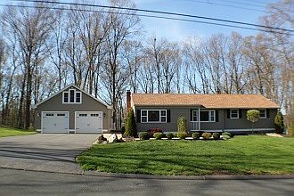 Ranch : House has open floor plan. Garage has oversize doors and second floor storage.