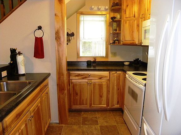Rustic birch cabinets.