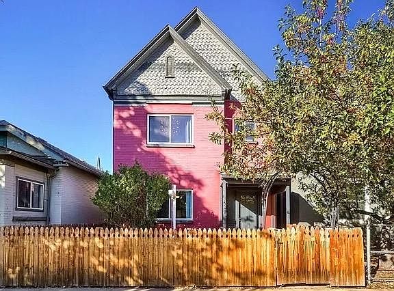 Front exterior with fence, plenty of space for entertaining in front and back yard.