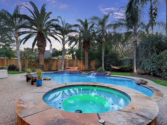 This tropical oasis will be the setting of many enjoyable afternoons and evenings. It will feel like you are on vacation! The sellers have installed a misting system to prevent pesky insects from hampering your outdoor time. The heated pool and spa w