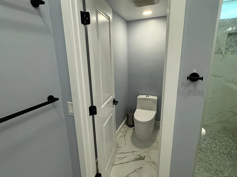 water closet in master bath back.