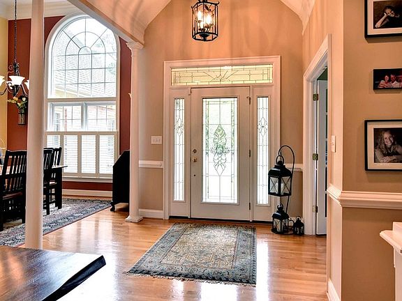 Entrance Foyer : Detailed and trimmed with columns and beautiful hardwood floor