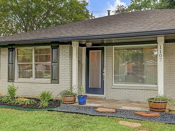 Beautiful front porch with trending colors ready for your enjoyment!