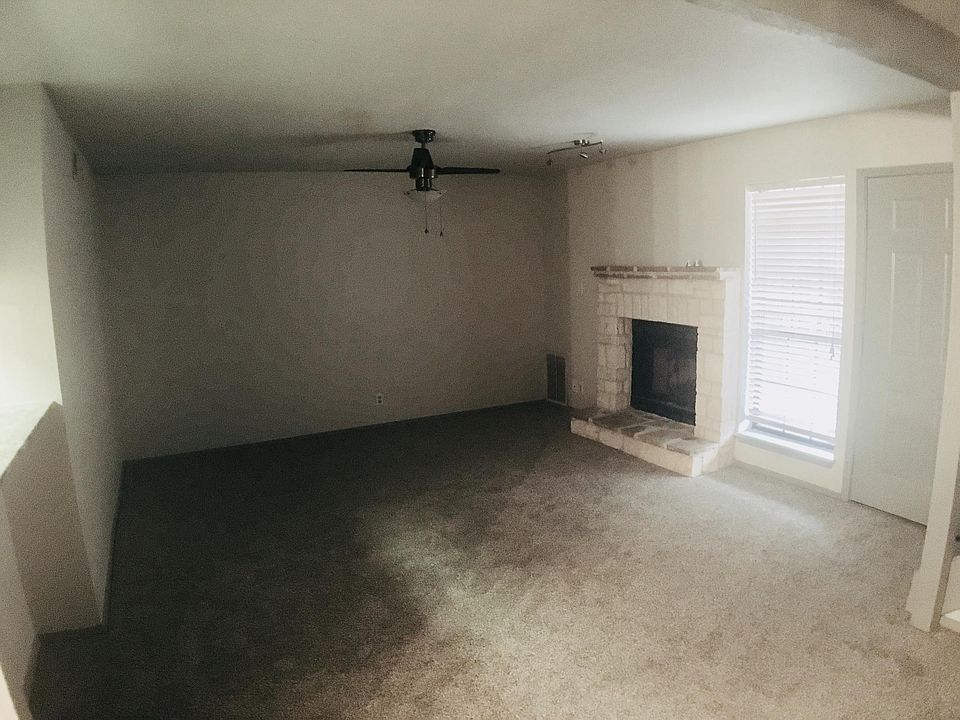 Living room with fireplace and pass thru to the kitchen