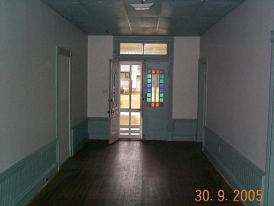 Entry Hall or Living Room with 2 doors leading to rooms on the right and the bathroom is as if it were behind us.