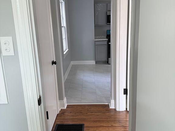 View from bathroom into kitchen. Hall closet on the left.