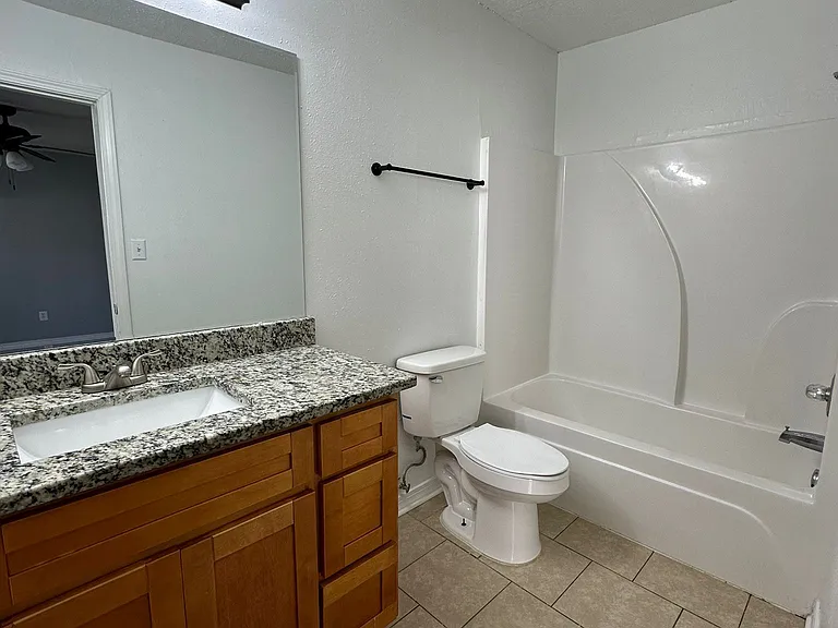 This is the second bathroom in the apartment. It is located within the master bedroom.