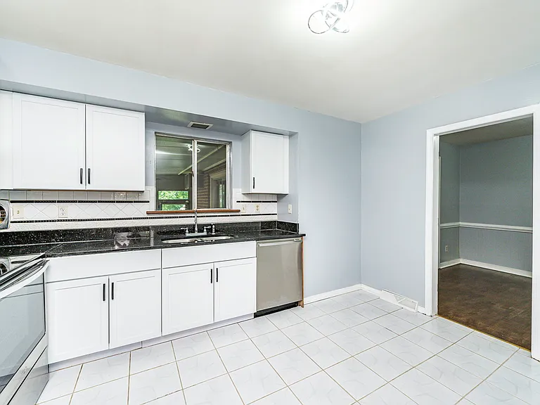 Renovated kitchen with new cabinets, granite counters and stainless steel appliances!