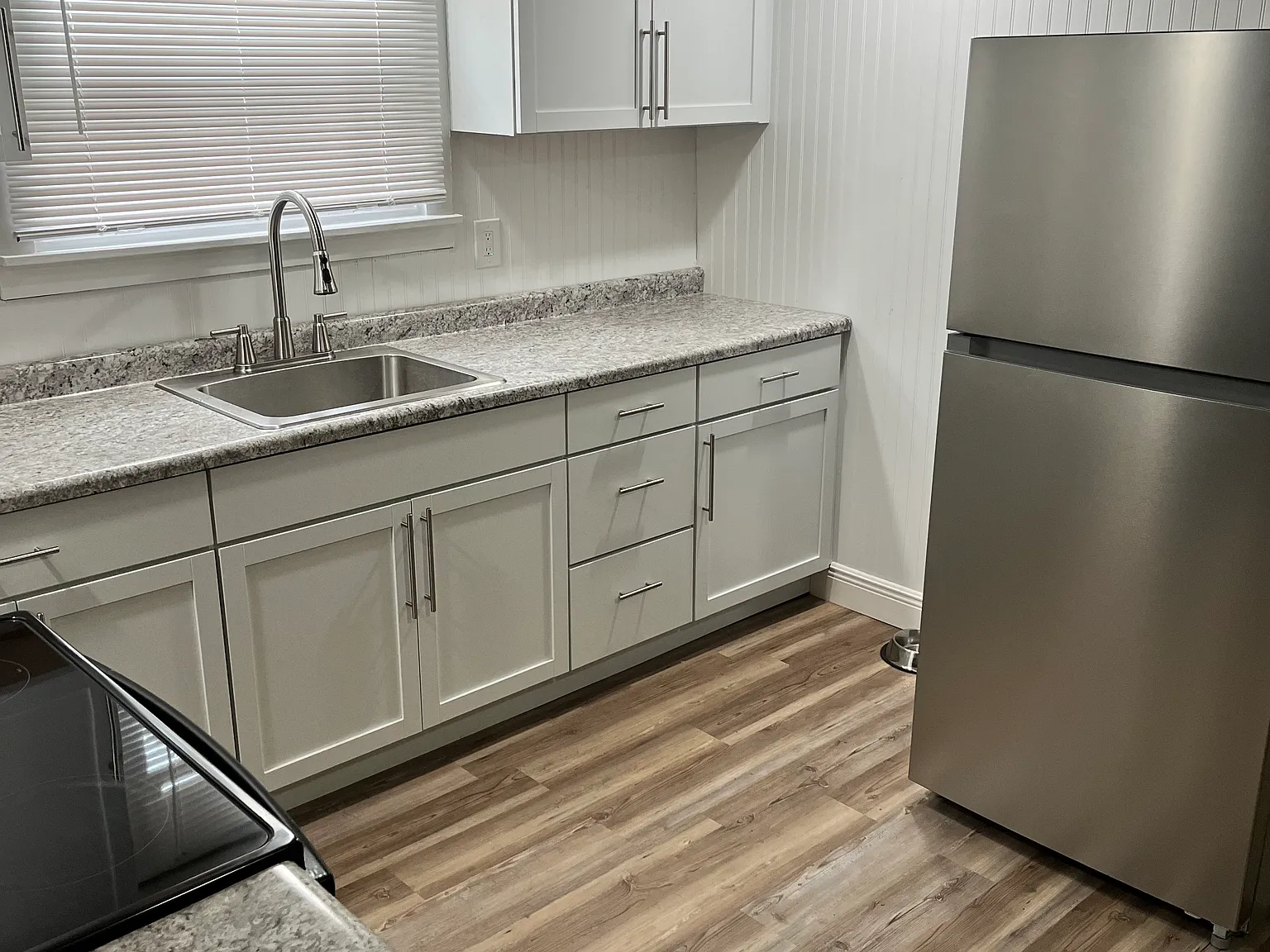 Unit 2 kitchen. Equipped with stainless steel appliances.
