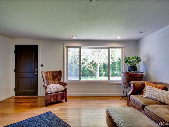 Living room with views of lovely private front yard. 