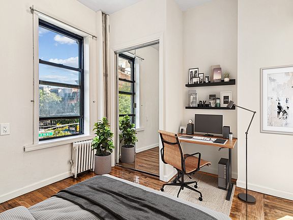 5th image of 242 E 10th St APT 11