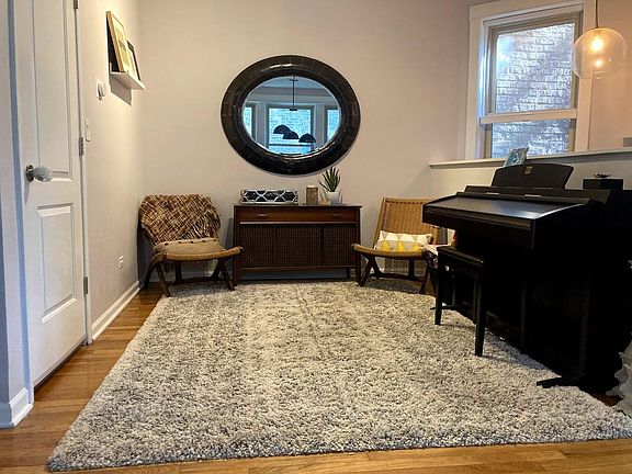 "Music den" and closet with shelving. Stairwell to downstairs behind the short wall.