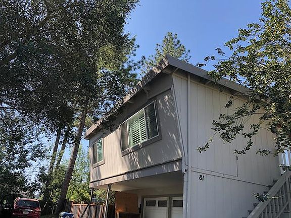 This is the outside of the house. Parking is in the driveway in front of the house. There's room for two cars. It's a flight of stairs to the front door. Upside? No gym membership needed! Whoop!