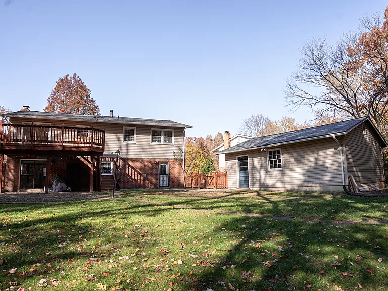 Oversized backyard fenced in. Deck and patio with three exits