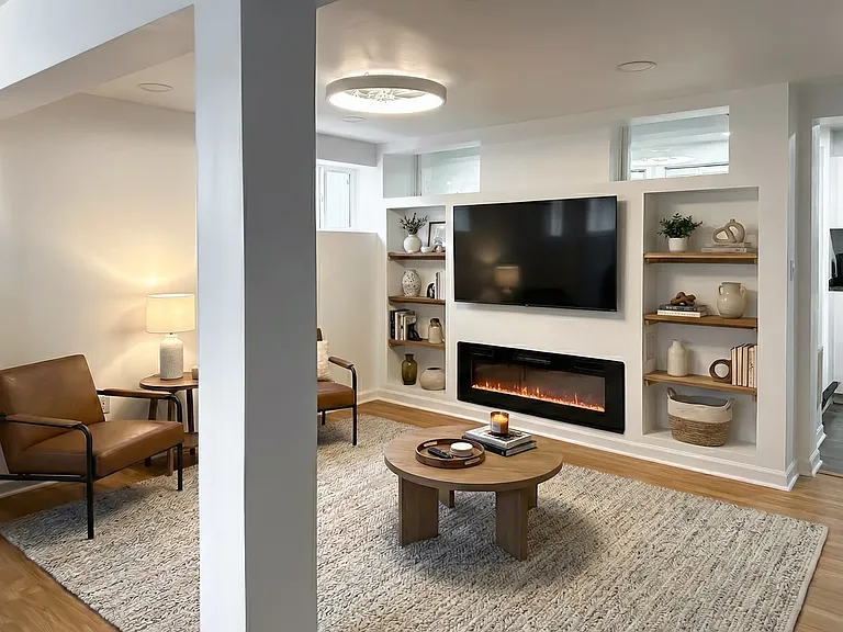 Three-season room with French doors, neutral finishes, and space for lounging, working, or relaxing.