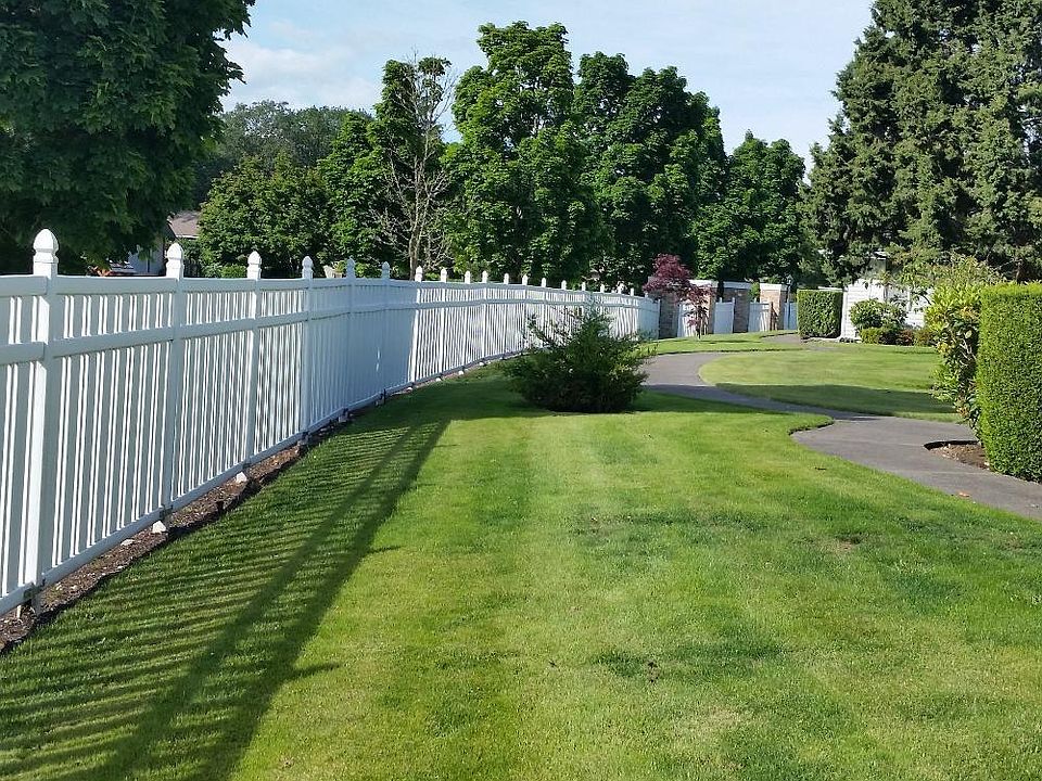 End unit with beautiful maintained area right out your front