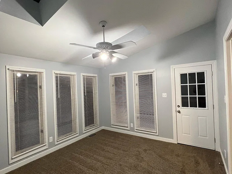 Photo of the florida room with skylights. New door to the back deck/backyard.