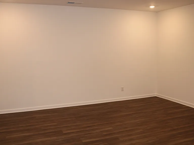 Large recreation room in lower level - Next to garage with full bath