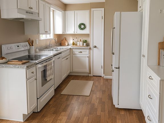 Kitchen with white cabinets and dishwasher