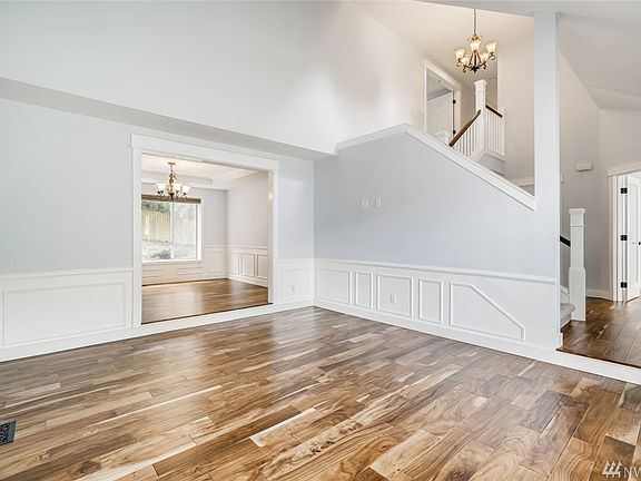 With a look to the dining room, you can also see the den to the right of the picture.