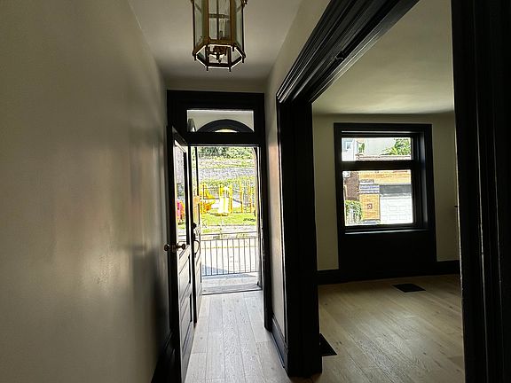 Front Hall with Play Park outside and Living Room on the right