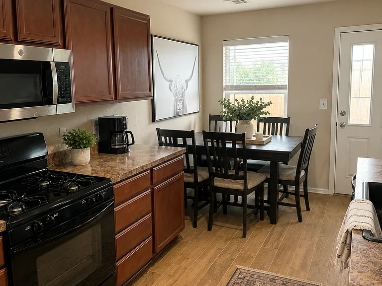 Kitchen/Dining. New microwave, sink, faucet. Stainless steel refrigerator with ice maker. (2 yo)