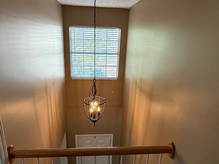 Upstairs hall facing front door/entryway