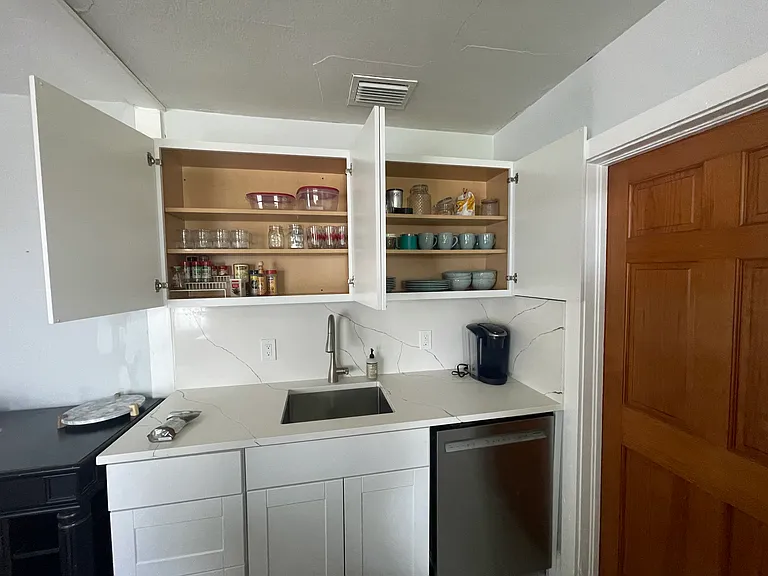 Fully stocked kitchen, pans, dishes, silverware, blender, mixer, and basics