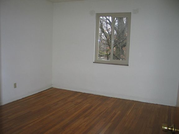 one of two bedrooms with closet