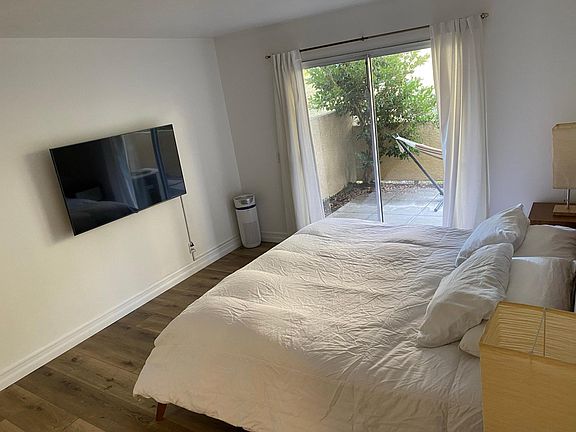 Generously sized master with private access to outdoor patio.